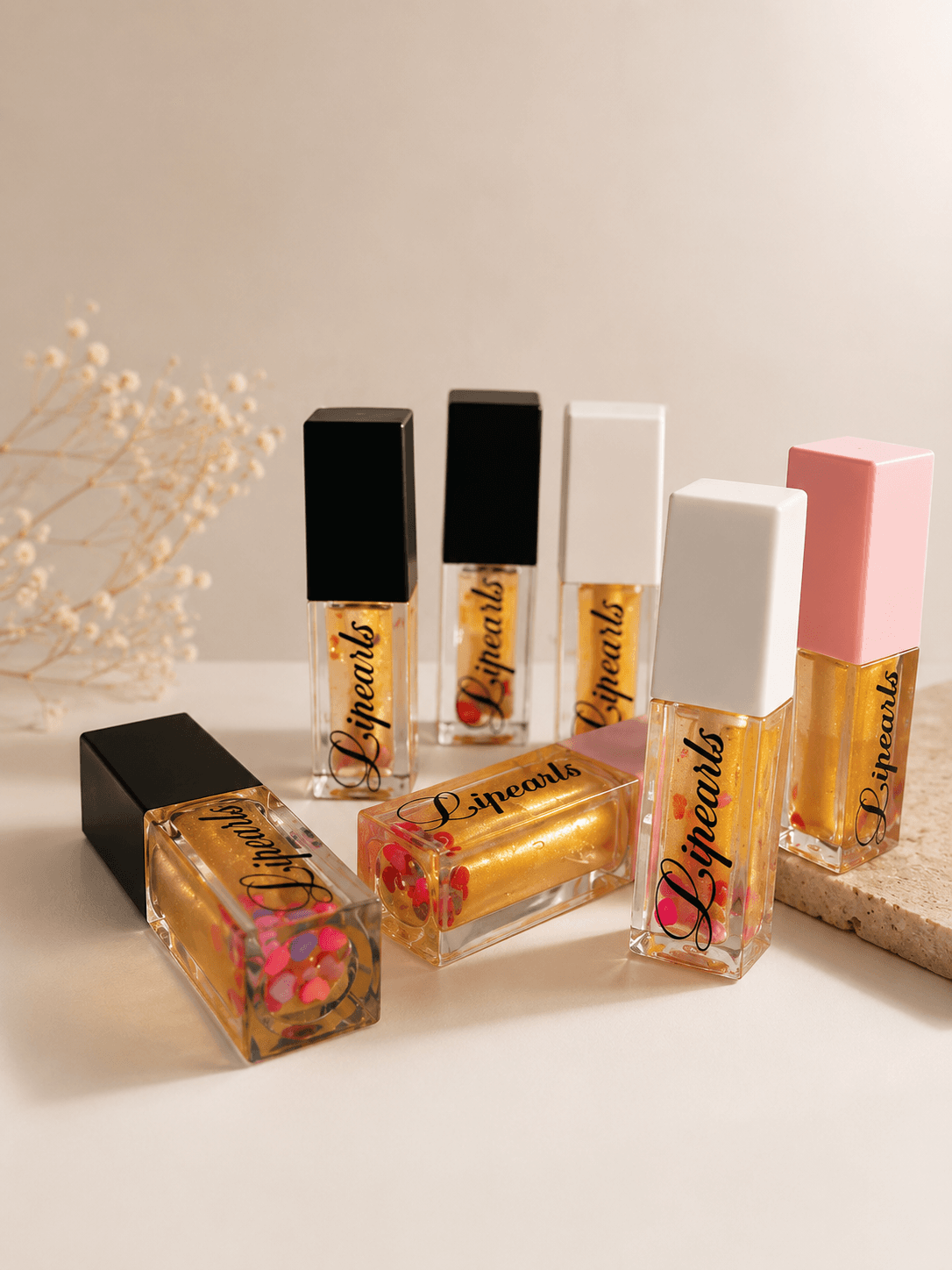 Pearlessence Beauty — gold shimmer Lipearls lineup
